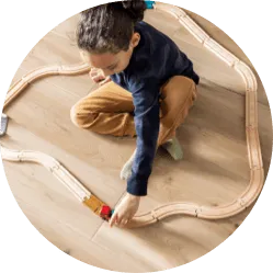 Kid playing with toy | Jordans Flooring
