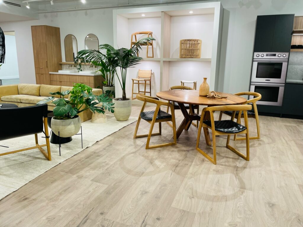 Laminate flooring with dinning table opening to the living room | Jordans Flooring